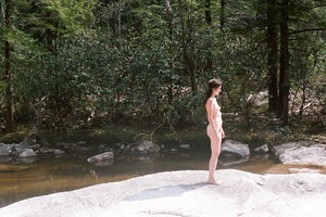 .a naked woman in the mountains